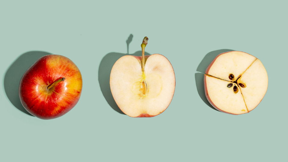 An image of an apple then next to that a half apple then next to that a half apple cut into thirds.